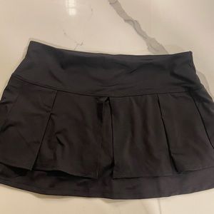 Lucky in Love black tennis skirt w/ pleated detailing in front and back. Size s